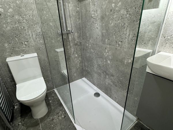 Toilet, walk  in screen,rainfall shower,vanity unit,porcelain tiles 