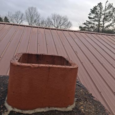 Cracked chimney flue tile and missing cap.