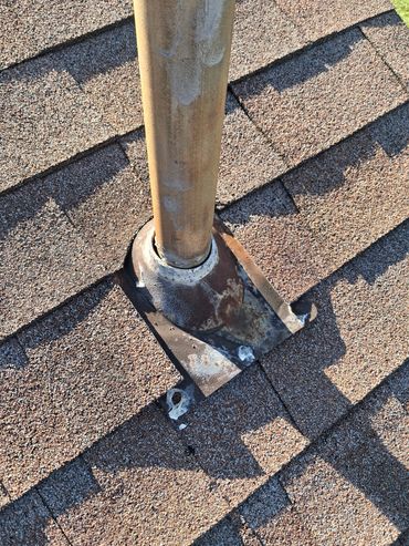 Damaged and dry-rotted plumbing vent boot on a shingle roof found during a Athens AL home inspection