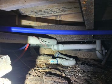 Disconnected PVC plumbing drain line in a crawlspace found during a Kelso, TN home inspection.