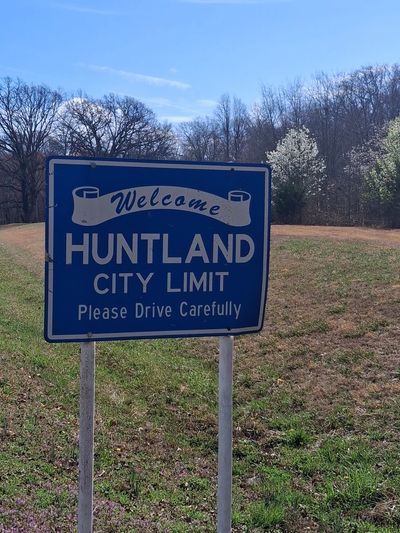 Welcome to Huntland City Limit sign on a sunny day in Huntland, Tennessee.