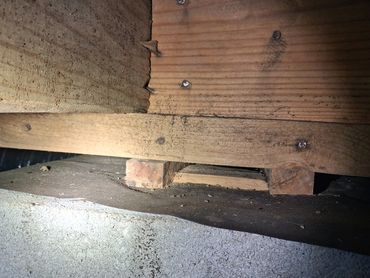 Defect found on a masonry pier in a Fayetteville crawlspace, identified by Atchley Home Inspections.