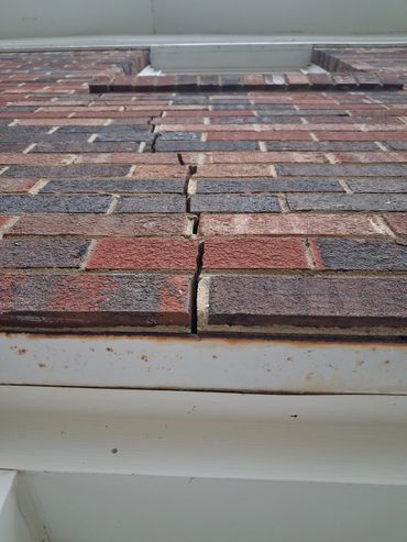 Vertical Settlement Crack in Brick Veneer.