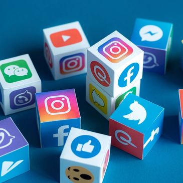 Cubes displaying various social media platform logos on a blue surface.