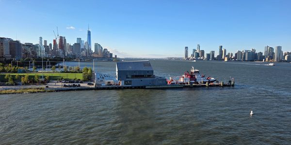 View of the New York City skyline and waterfront on a clear day.