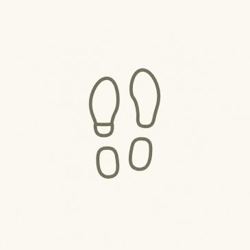 Minimalist drawing of two footprints on a plain background.