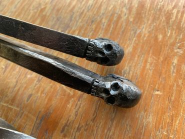 Forged fire poker
Skulls
Handmade fire poker
Steel fire poker