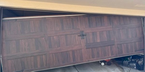 broken garage door off-track