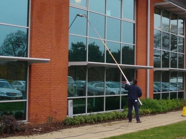 man cleaning commercial building with professional equipment 