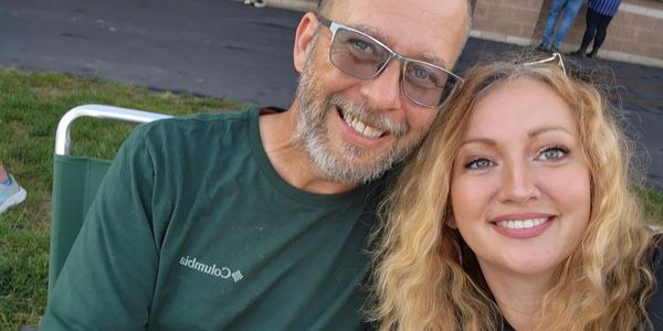 Owner and co-owner smiling