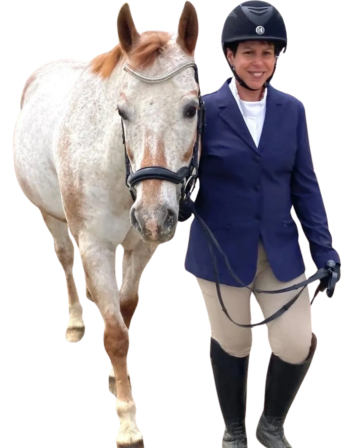 Man gently touching a white horse outdoors.