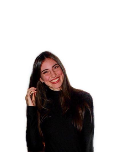 A smiling woman with long dark hair wearing a black outfit.