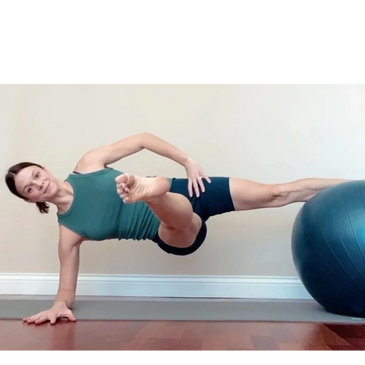 Lauren Valentine in a Copenhagen plank with stability ball.