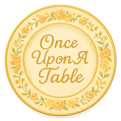 Decorative plate with 'Once Upon A Table' text surrounded by floral designs.
