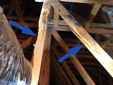 Pre-drywall phase inspection showing cracked and damaged trusses
