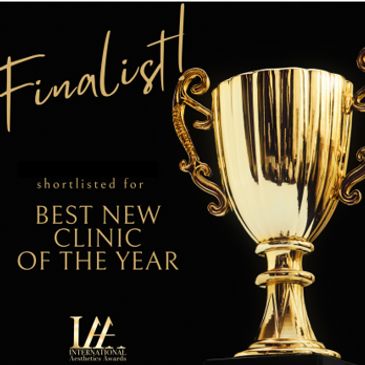 Golden trophy with text announcing finalist for Best New Clinic of the Year.