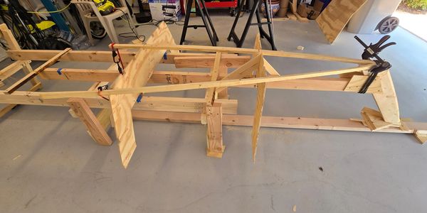 Starting with a small strong back and setup jig, the stem is set in position in this 12 foot skiff .