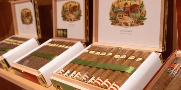 A picture of cigars in their cigar box