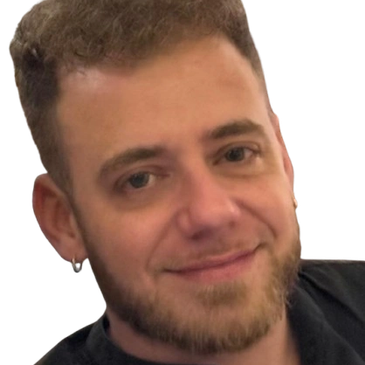 Smiling young man with a beard and earring.