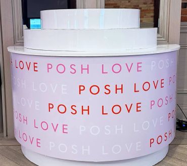 Circular display with repeating words 'POSH LOVE' in various colors.
