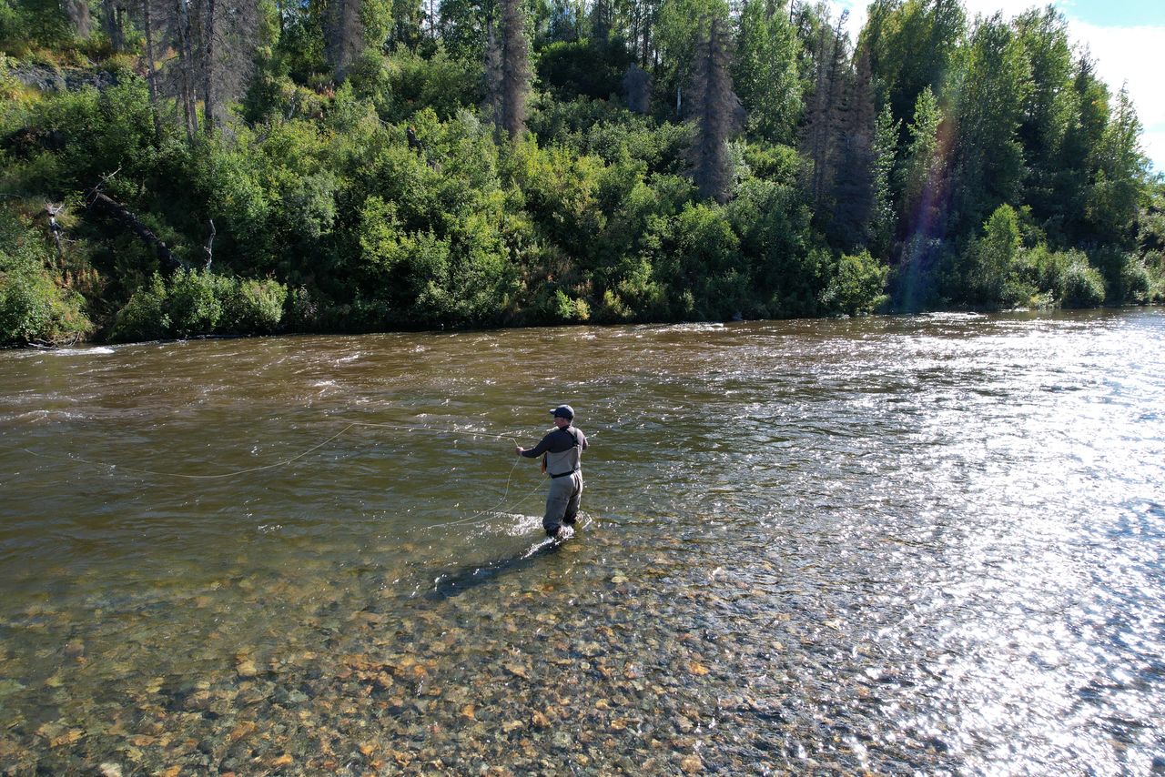 A fisherman fishing with fly fishing. Beautiful cord rings when casting Circle Castes, Voodoo Castes