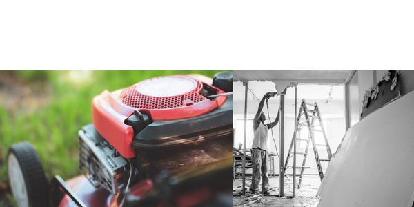 Close-up of a red lawn mower on grass.
