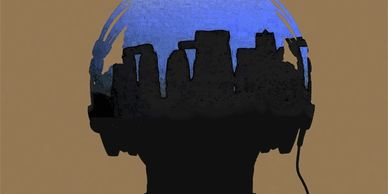Silhouette of a person wearing headphones with a city skyline inside.