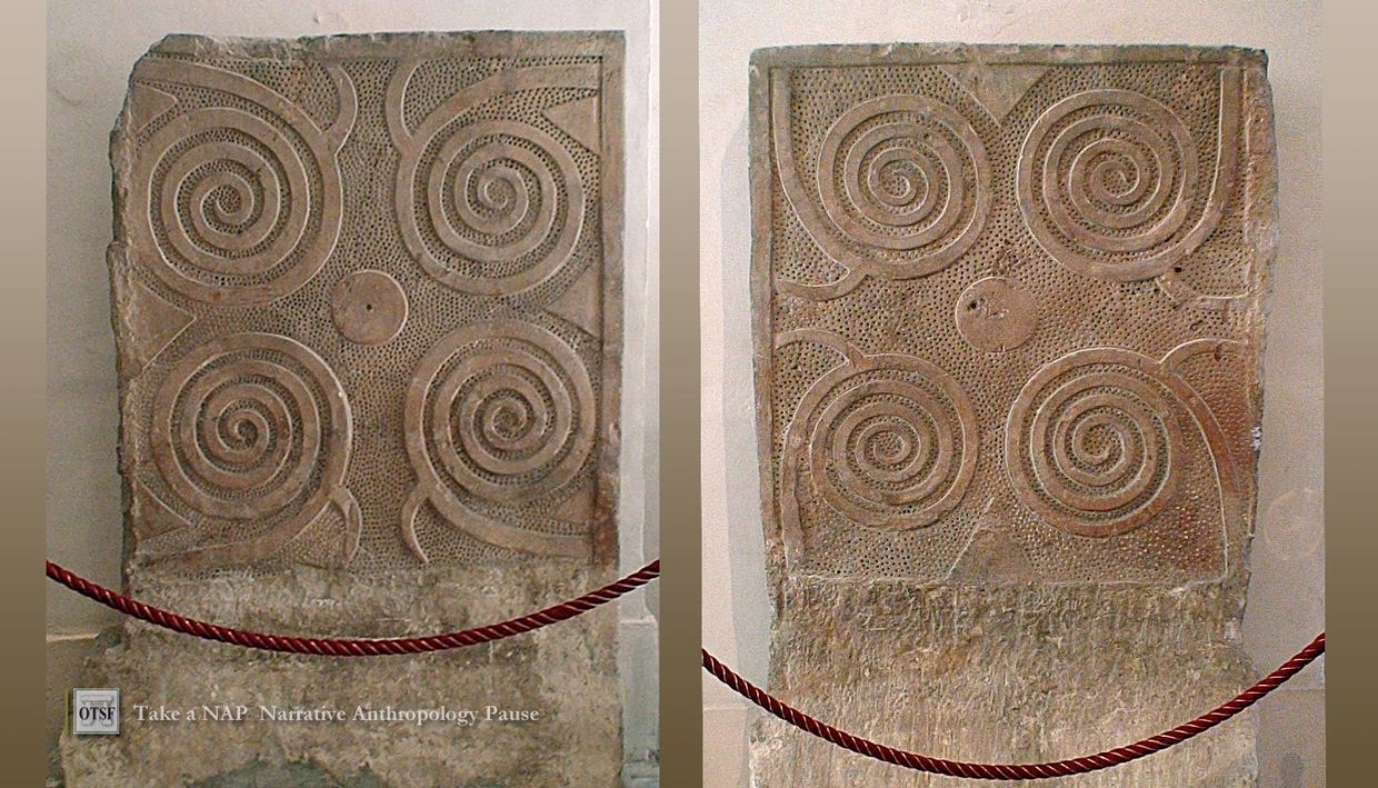Ancient stone slab with spiral carvings.