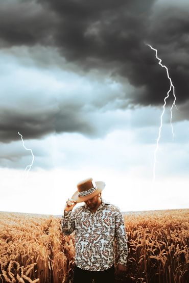 Dylan Shelley album cover photo photographed in a field in the PNW