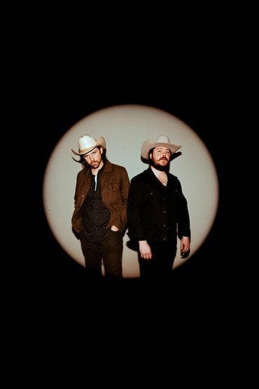 music duo photographed in a photo studio in Tacoma, Washington