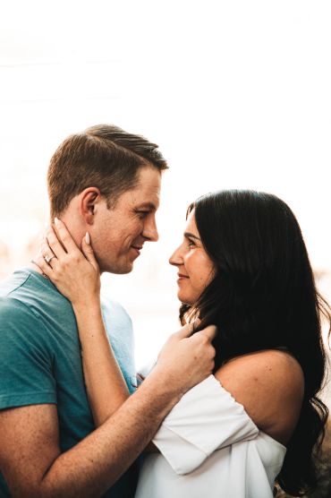 Couple looking into each other's eyes closely.