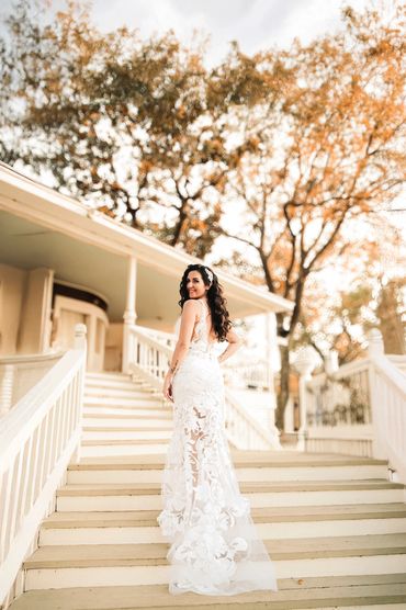 bride poses on stairs at her PNW wedding