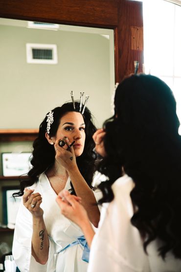 bride does her makeup before her PNW wedding