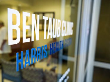 Office door with Ben Taub Clinic and Harris Health System names.