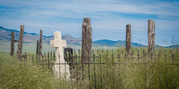 A gravestone on the prairie.