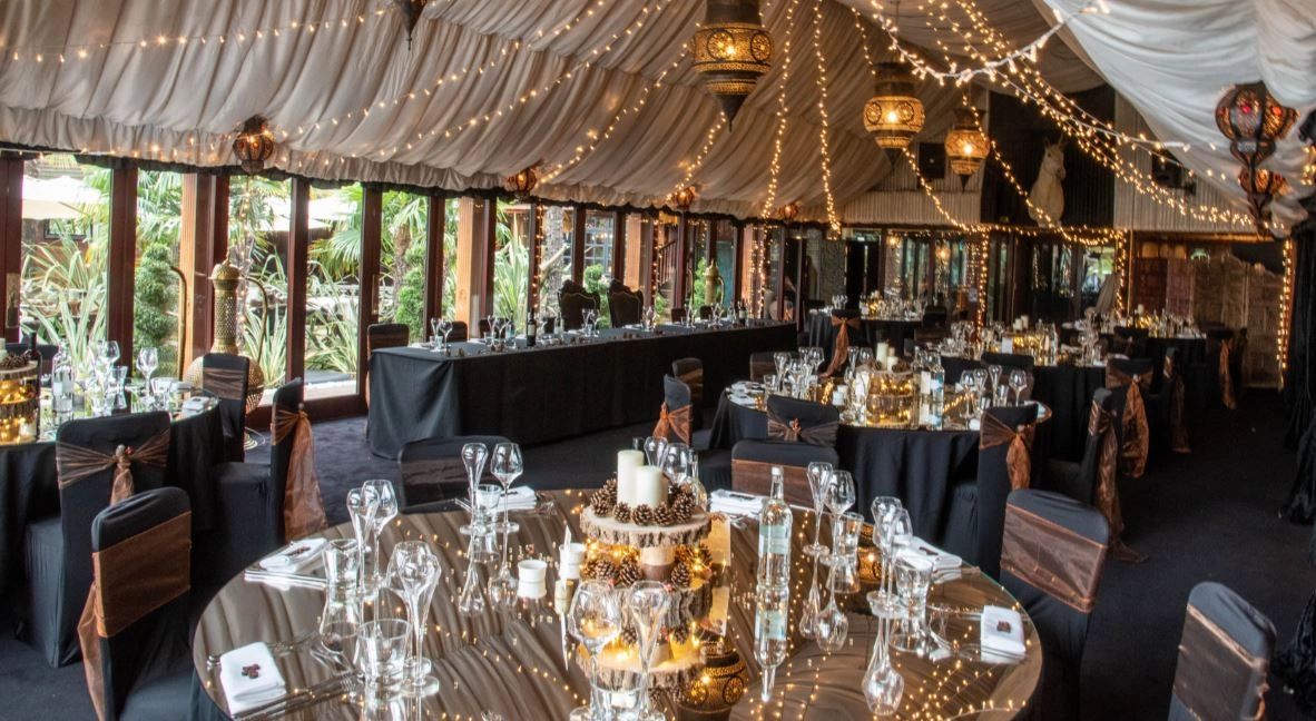 Reception room decor at the Crazy Bear, Stadhampton. Lights, rustic centres, sparkle with warm glow