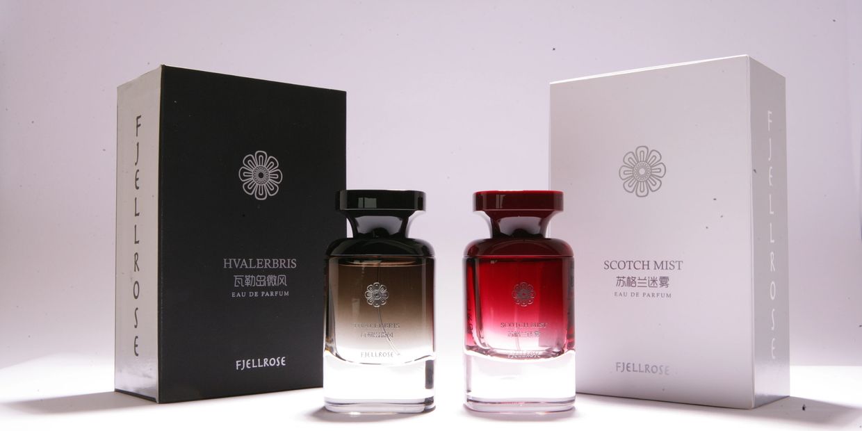 Two elegant Fjellrose perfume bottles with black and white boxes.