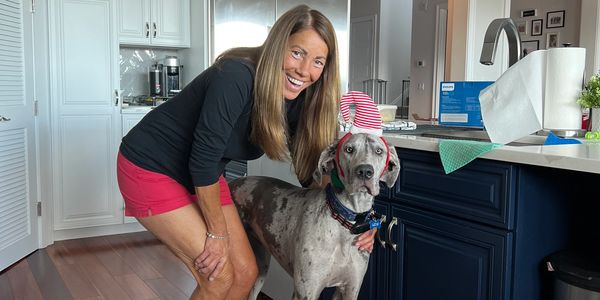 Owner and Certified Trigger Point Massage Therapist and her Great dane, Liza