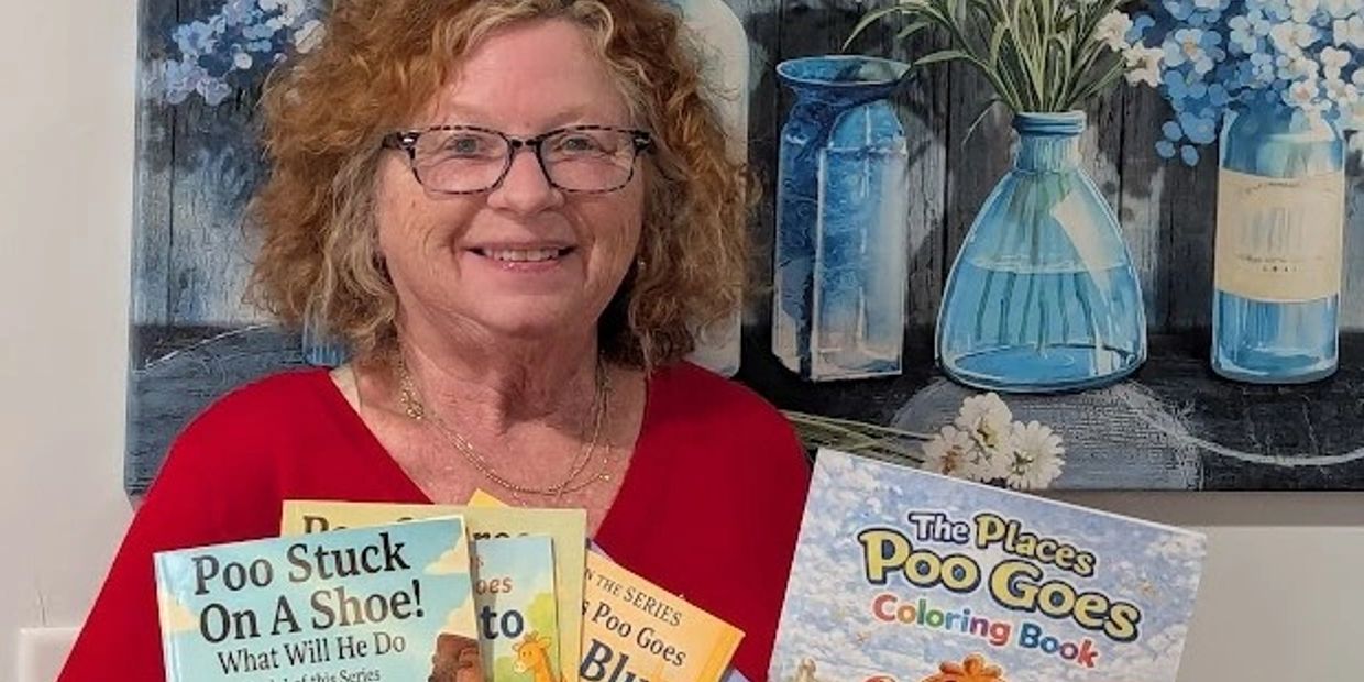 Woman holding children's books titled about Poo Goes series.