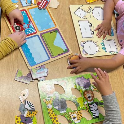 preschool children completing puzzles 