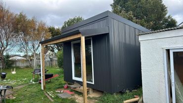 Wall cladding and roofing of a workshop shed.