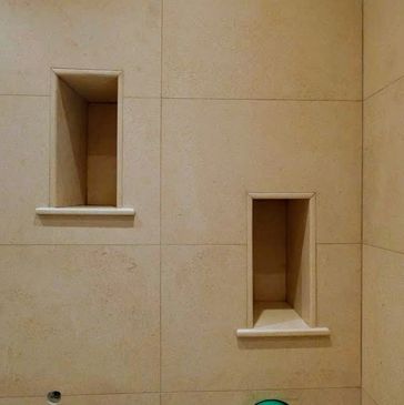 Elegant limestone shelves: natural stone texture. A Master-Level finish for your wet room.