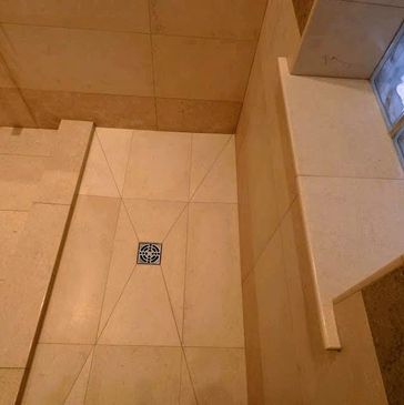 Luxury stone shower: showcase bullnose curb and windowsill. Tile Marble Granite excellence.