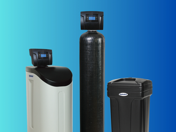 Three modern water softener units against a blue gradient background.