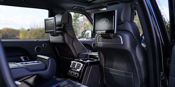Interior shot of Range Rover Vogue for hire in black, featuring premium leather.
