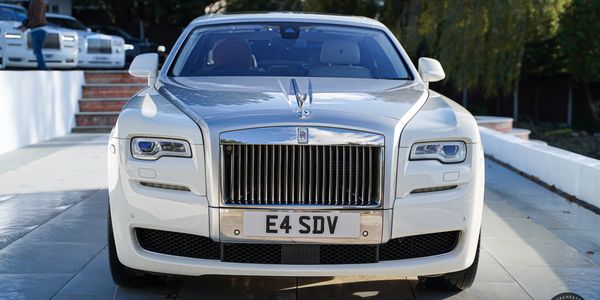 Close-up of Rolls Royce Ghost 2 sleek silver grille, a symbol of modern luxury.
