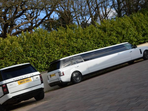 White Range Rover Stretch Limo a 16-seater luxury limo hire London side profile shopt