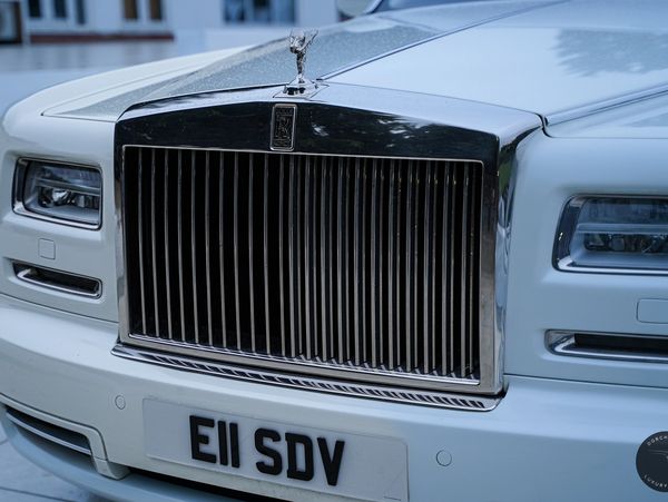 Rolls Royce Phantom 2's classic silver exterior exuding timeless elegance.
