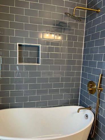 A tiled shower and tub.