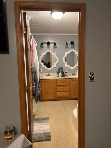 New mirrors and lights in the bathroom.